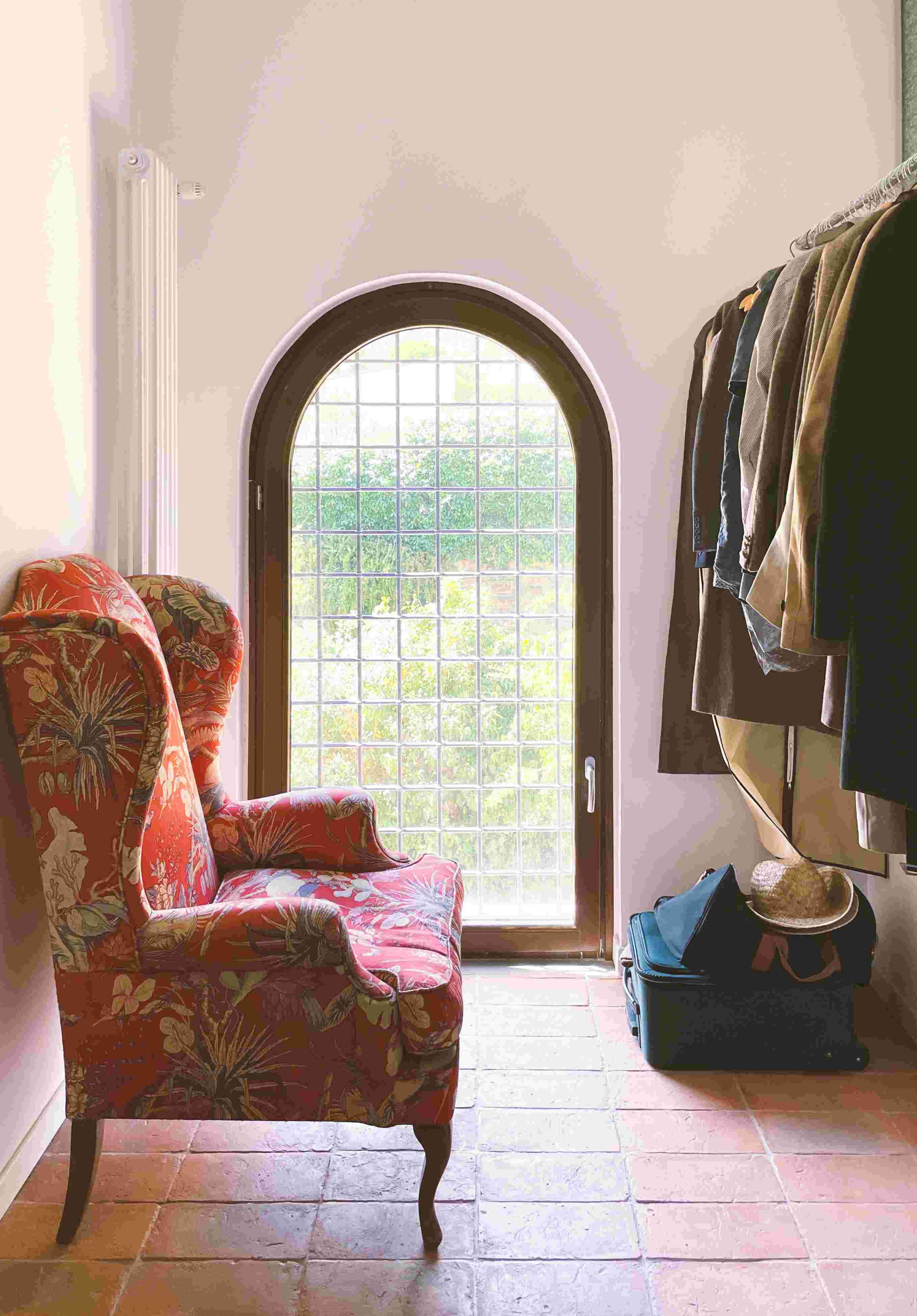 Restored interior — arched window and terracotta floor