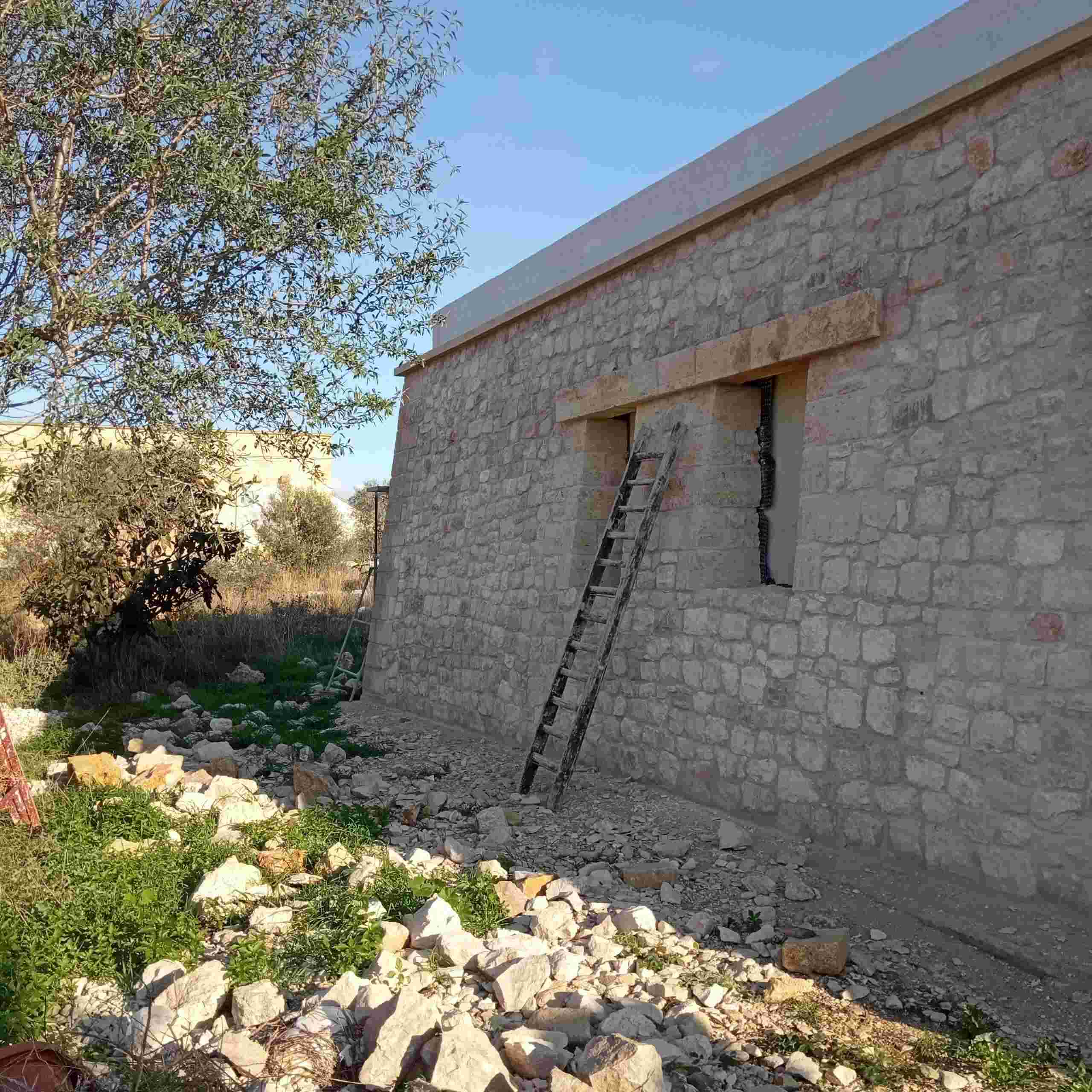 Stone wall restoration — heritage masonry in progress
